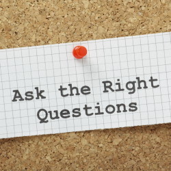 Ask the Right Questions sign pinned to a corkboard