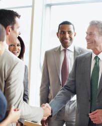 test successful business people shaking hands to fix a deal at office