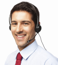 happy customer service executive with headphones. Horizontal shot. Isolated on white.