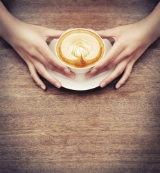 Barista holding latte