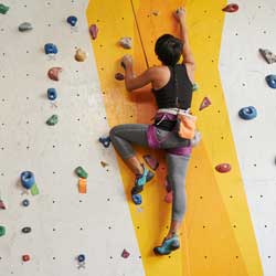 Athletic Woman Rock Climbing
