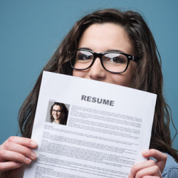 test Young woman holding her resume
