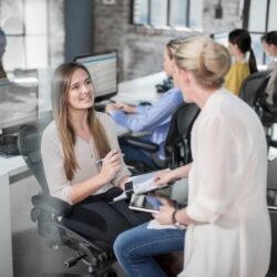 test Female manager meeting trainee teenage girl in office